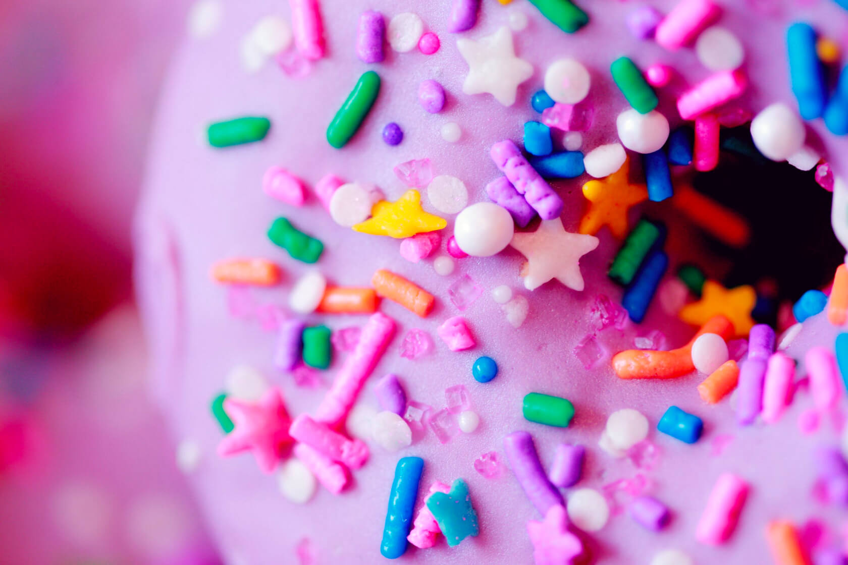 A pink birthday doughnut with sprinkles on. Because Birthdays are for cake, and cake only.